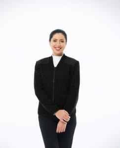 woman wearing black v-neck zip up sweater with pockets and shoulder and elbow patches