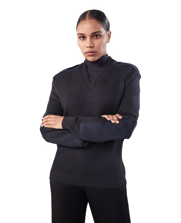 woman in navy v-neck knit sweater with shoulder and elbow pads