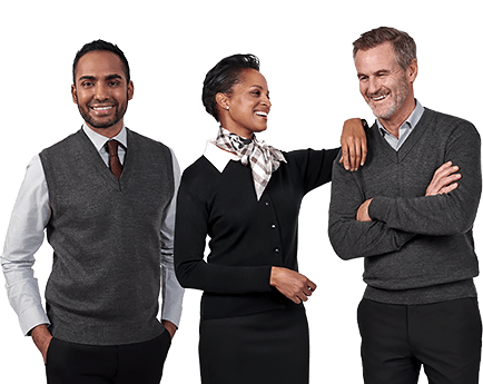 Three employees in uniform sweaters