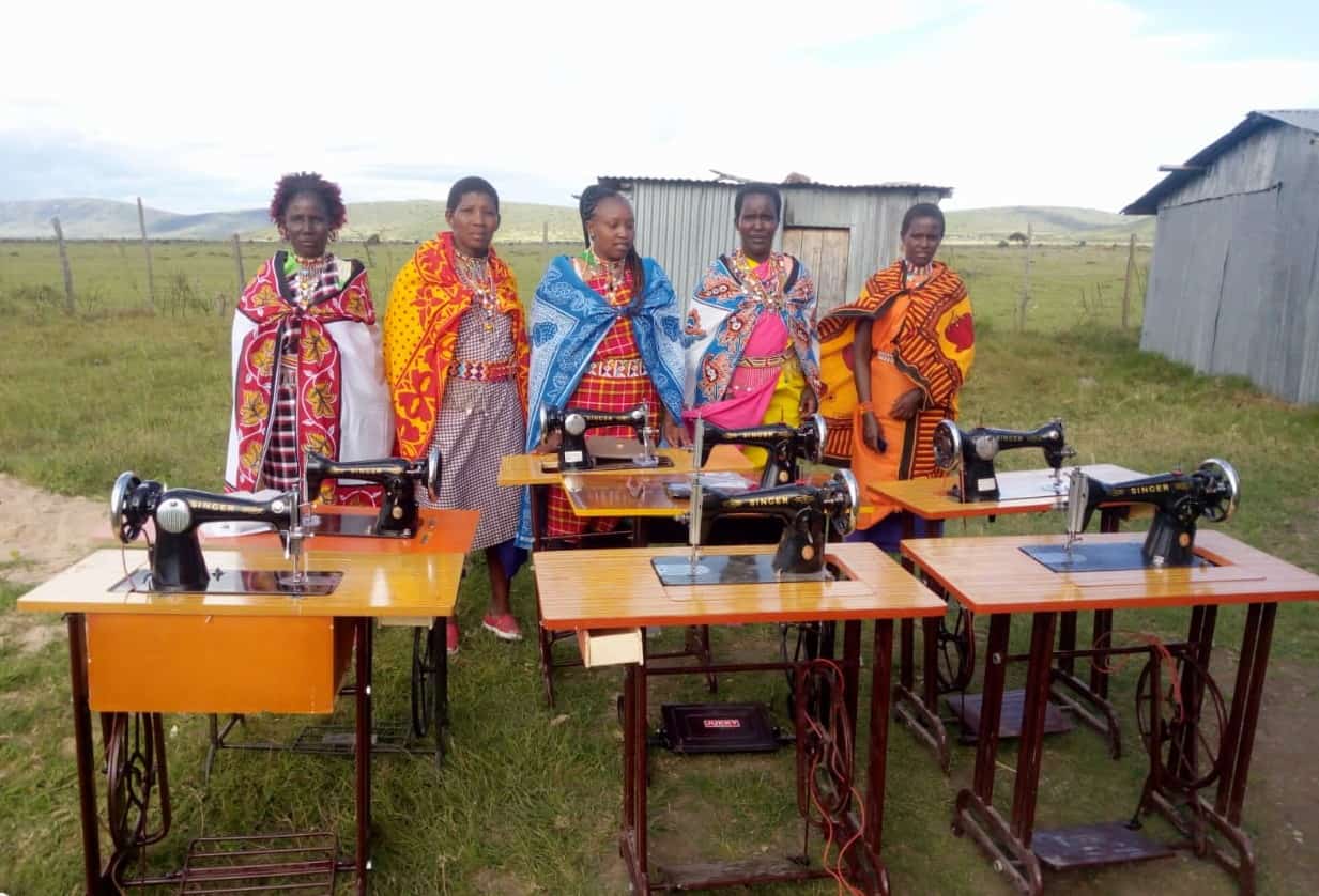 African women with donated sowing machines
